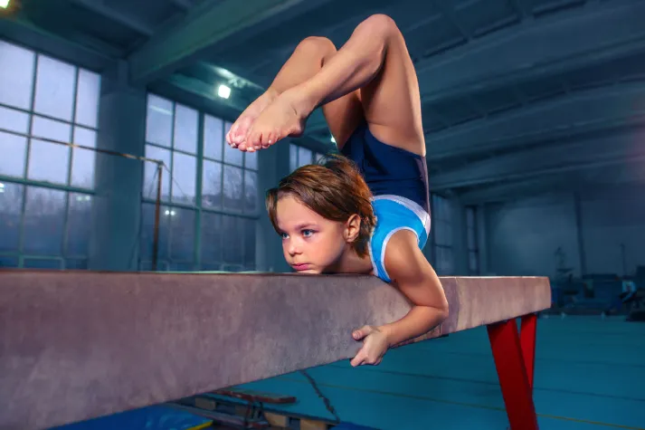 beautiful girl is engaged in sports gymnastics